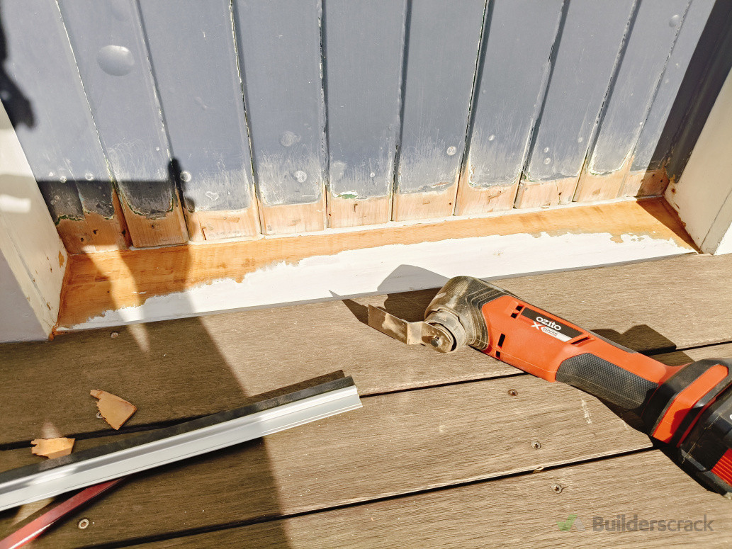 Squaring up the door sill in preparation for a storm stopper