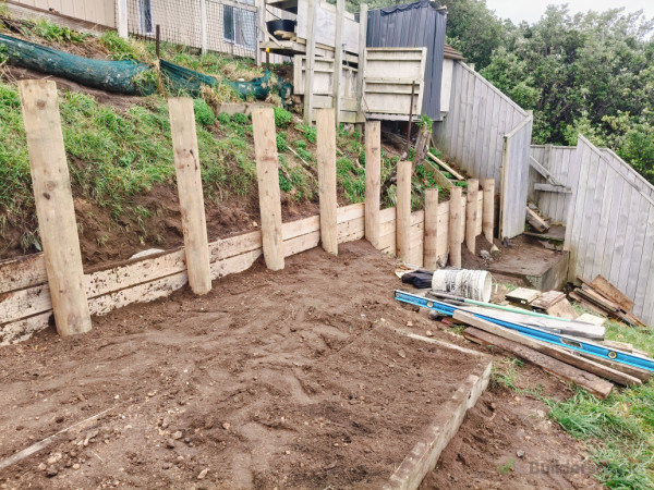 Initial boards on to secure horizontal levels, and dirt redistributed