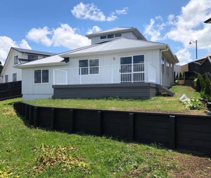 Built the retaining wall , deck and house on this job