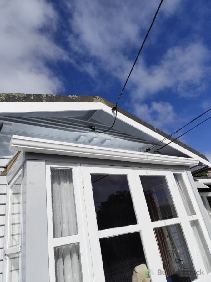 Installing gutters.