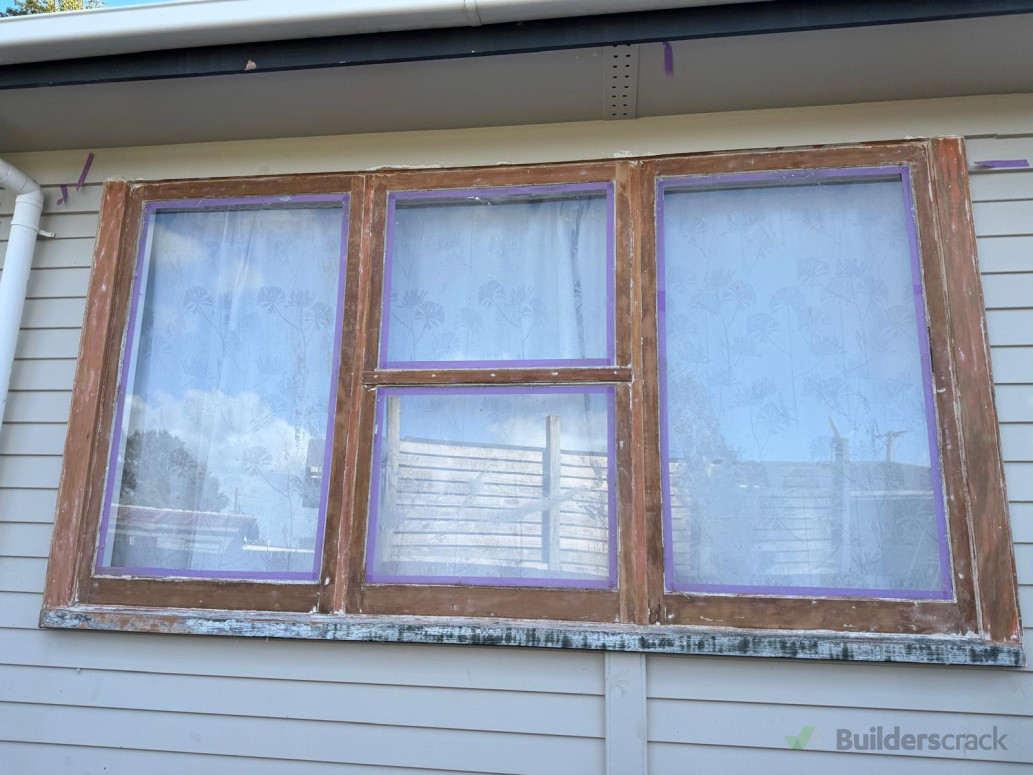 Old flaking/peeling paint stripped to the bear wood