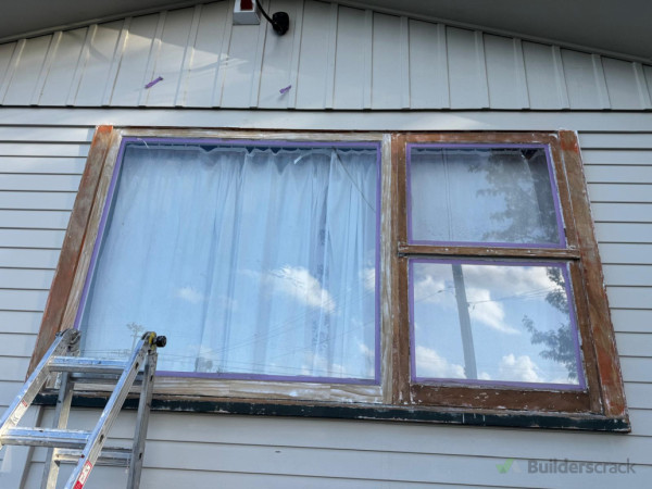 Old flaking/peeling paint stripped to the bear wood