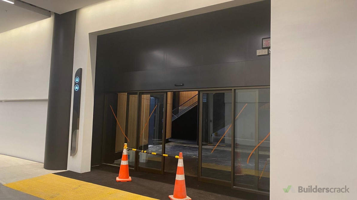 Commercial building,  NZICC building:     Level 4 plaster finish and painting completed to entrance feature wall with slimline corner detailing.