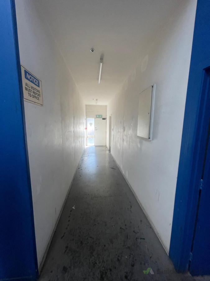 Completed interior painting works to walls and ceiling, delivering a clean and smooth professional finish throughout the corridor area.