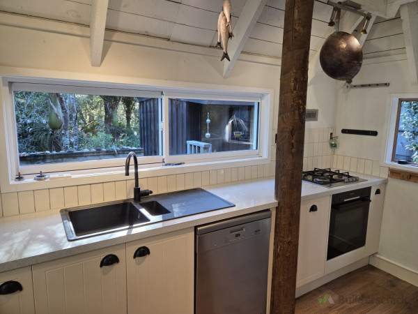 Install new wall tiles on splashback