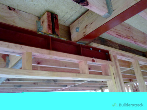 Cut, Drilled, Welded 6 steel beams for the2 storey home.