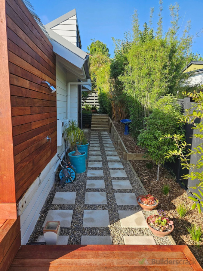 Castor bay paving and stones aall around house with retaining and steps