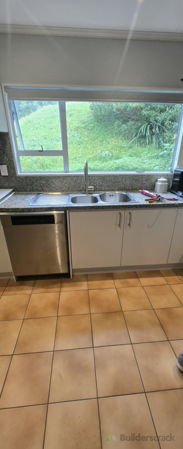 Kitchen cabinet damage replacement and plumbing repair works completed.