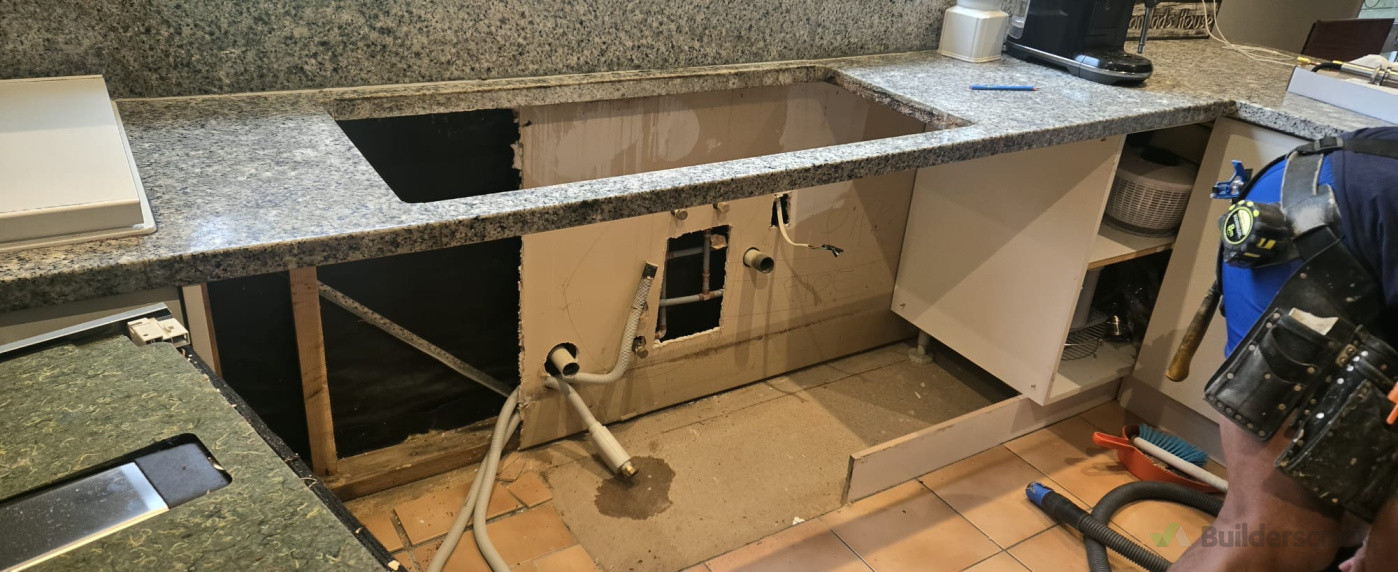 Before- Replacing old plumbing and damaged cabinet