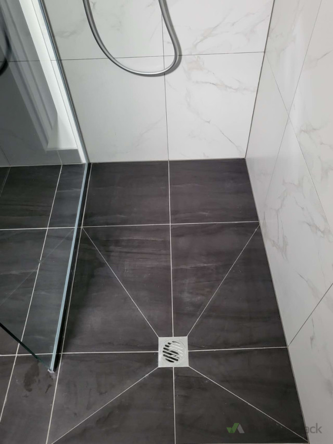 Fully demolished. Curbless entry level Walk-in shower built up by lower subfloor of shower area. Builder had done an amazing job.