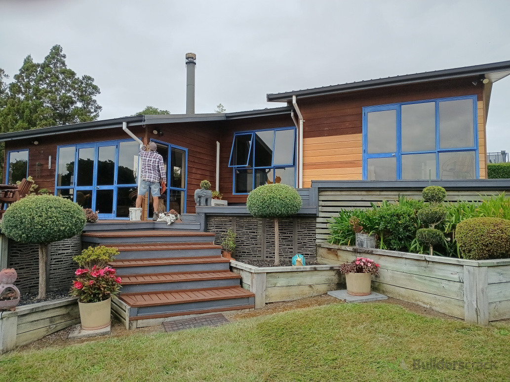 New weatherboards stained darker to match old boards.