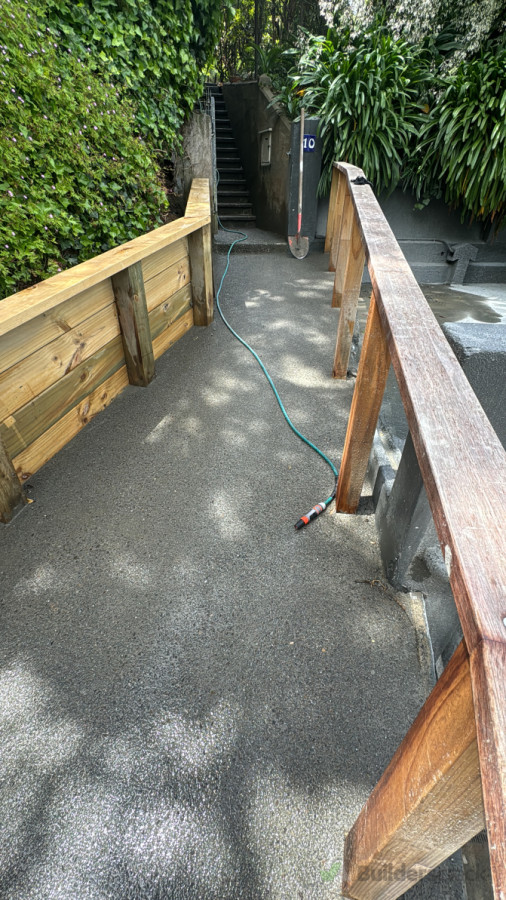 Exposed concrete path and retaining wall