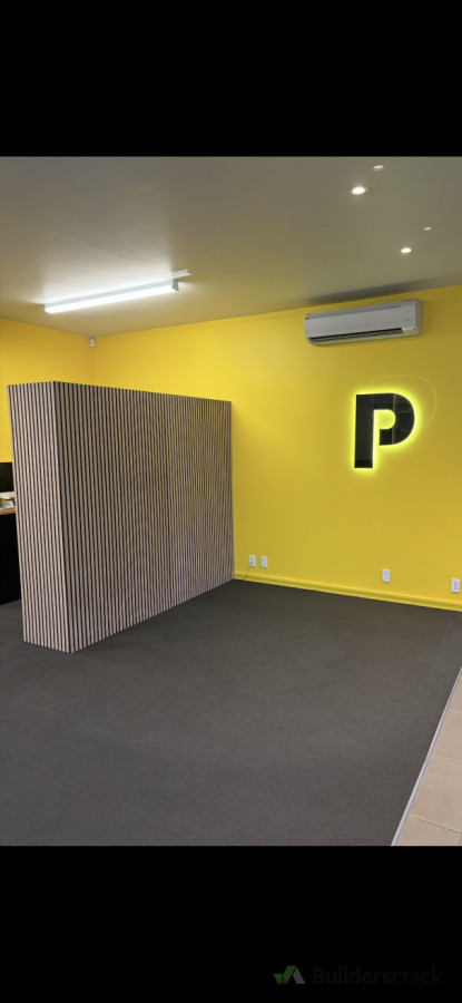 Slat panel wall for reception area at Printers Inc