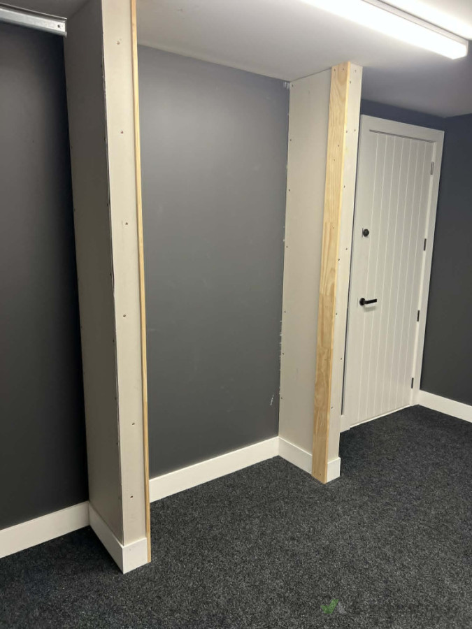 "Garage storage build progress—framing, sheeting, and skirting completed and ready for plastering."