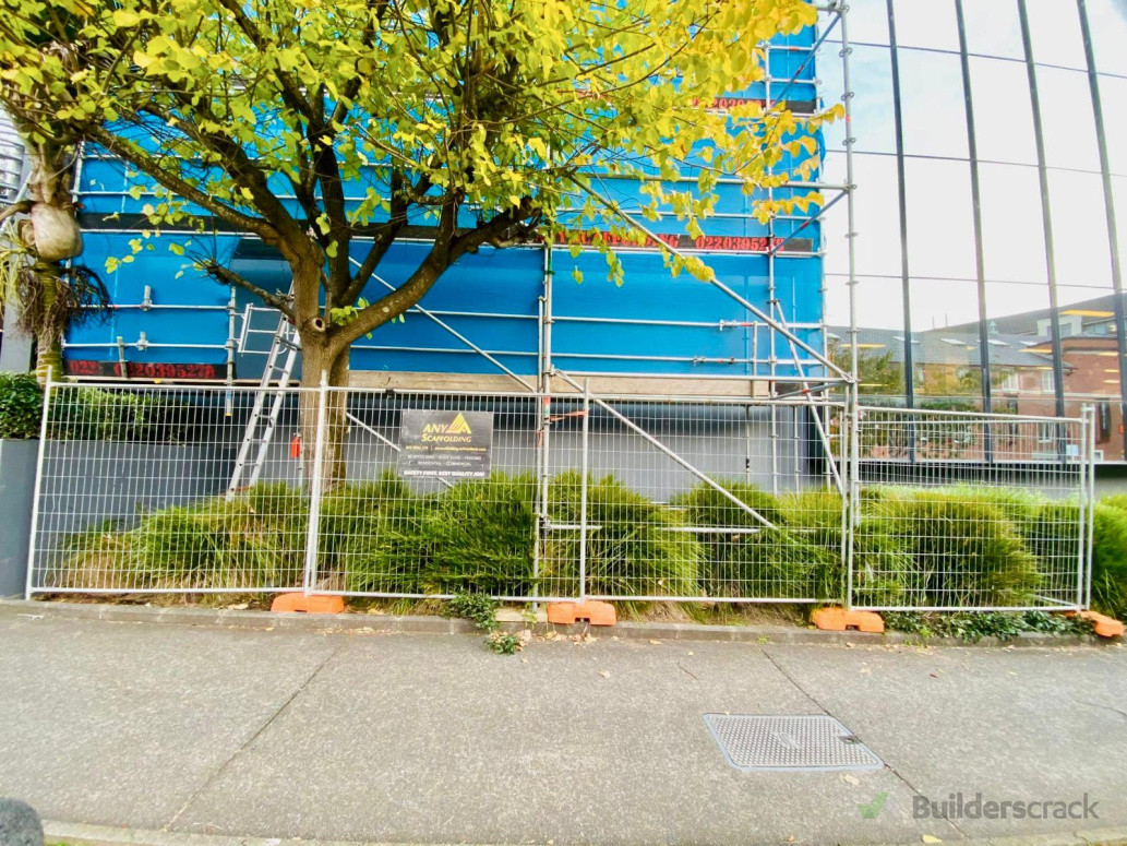 Scaffold and temporary fence.