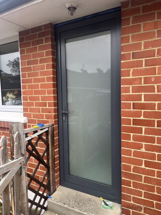 New aluminium back door replacing old wooden door