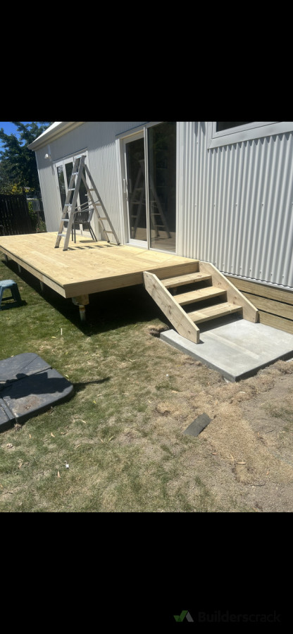 Deck, steps and base boards leading upto a new tiny home.