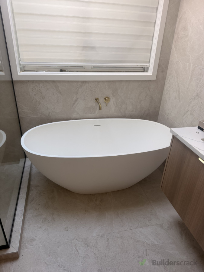 bathroom renovation featuring freestanding bath