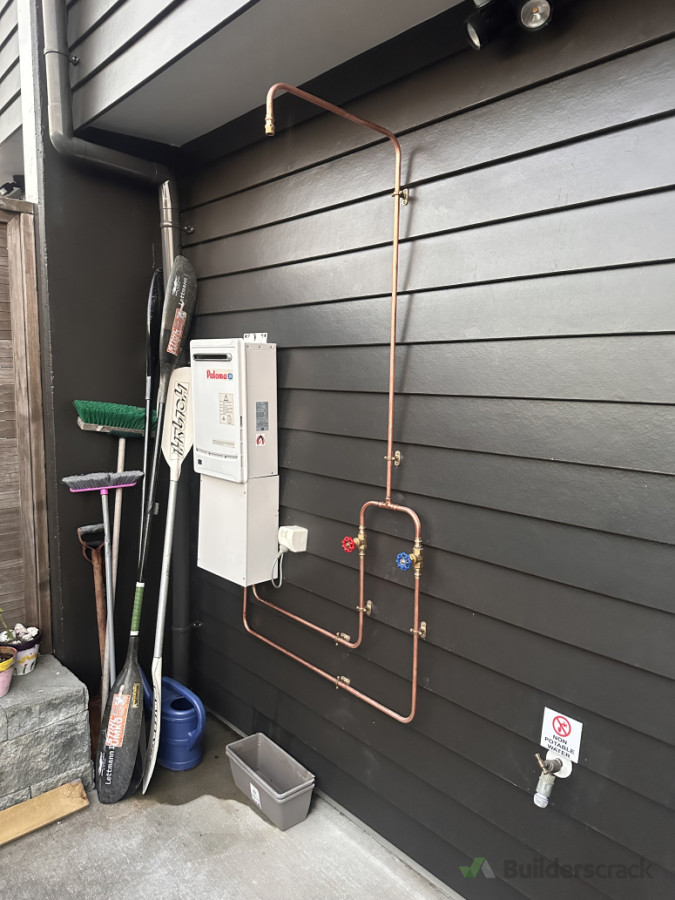 outdoor shower, home made all copper was bent and pressed home owner supplied the copper shower head