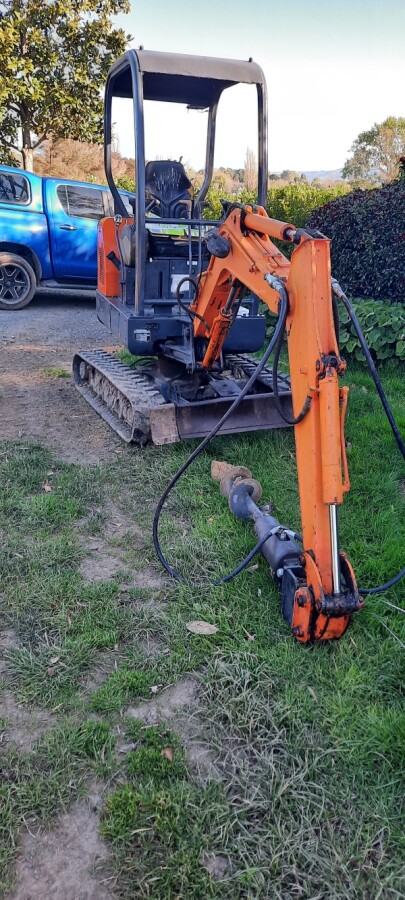 Digger with auger and trailer also licensed and insured