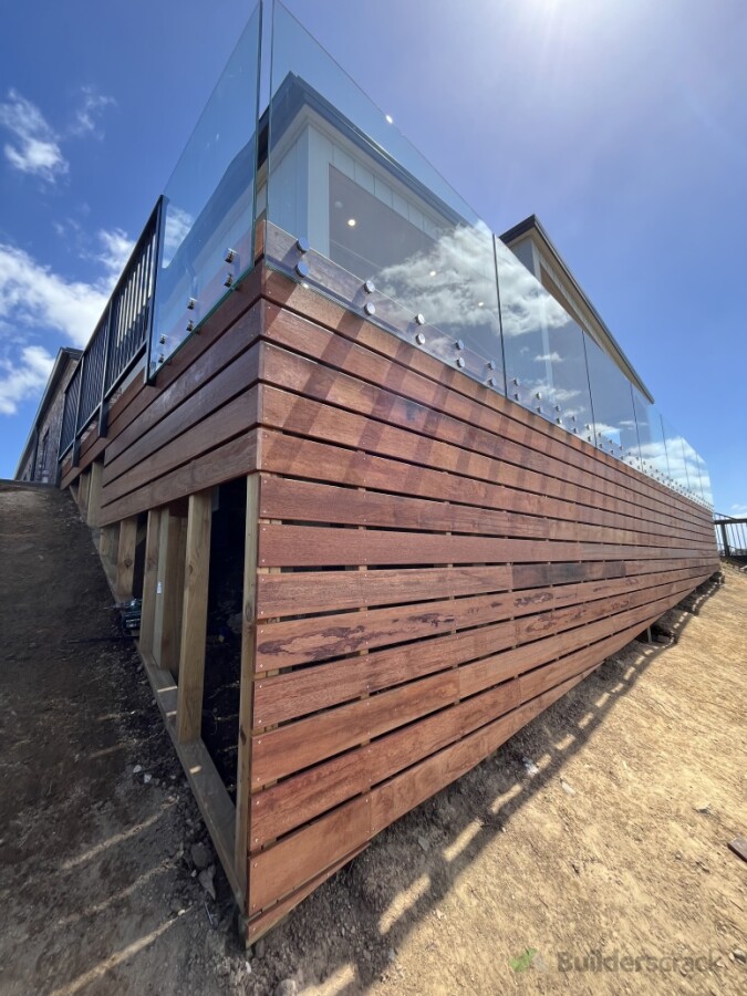 Kwila deck with glass balustrade and base boards