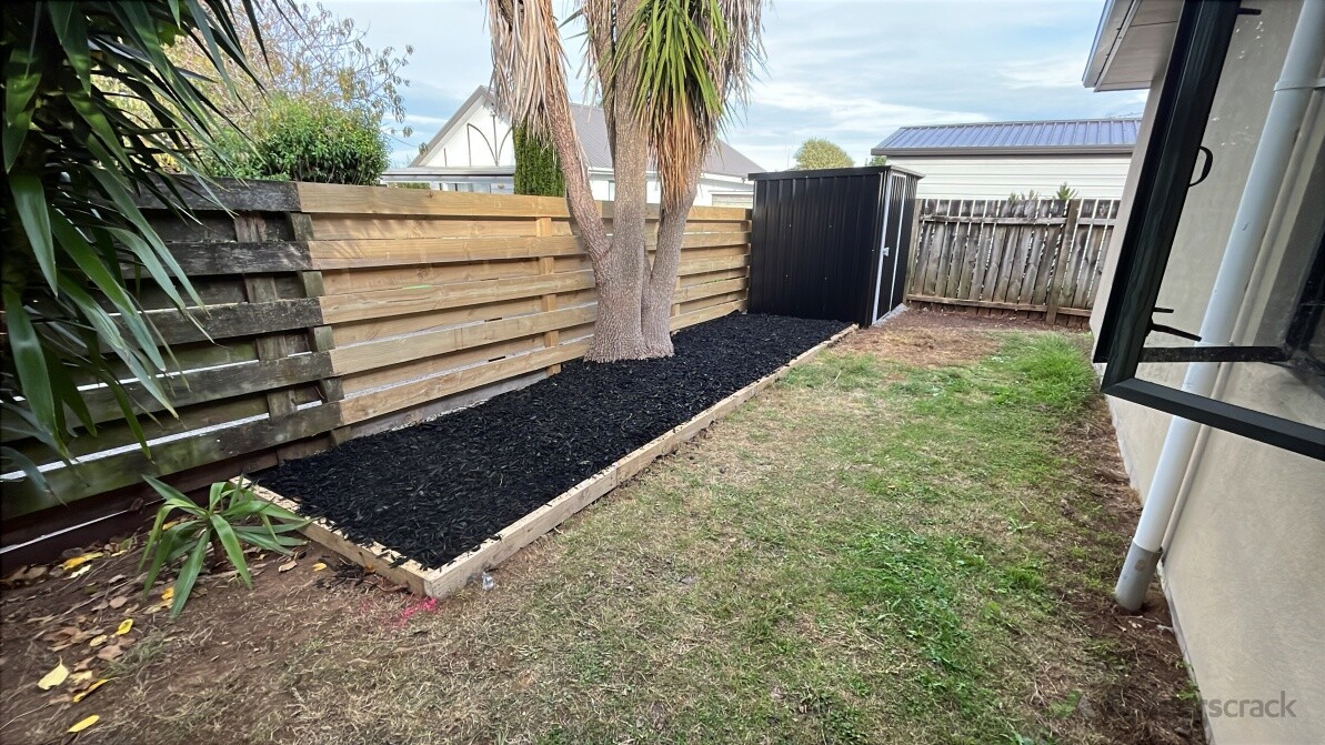 Existing fence rebuild with a small garden shed and mulch garden