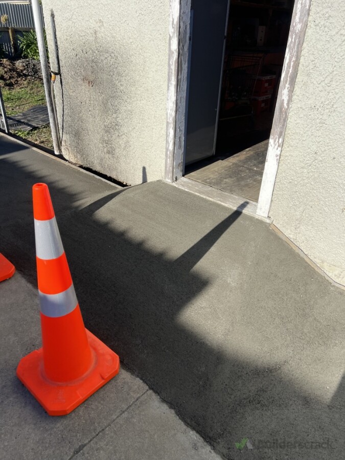 Concrete pathway and accessibility ramp professionally formed and finished.