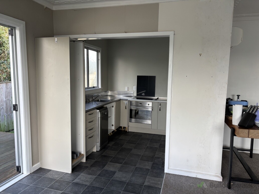 A 20 year old kitchen we were hired to open up and turn into a functional space
