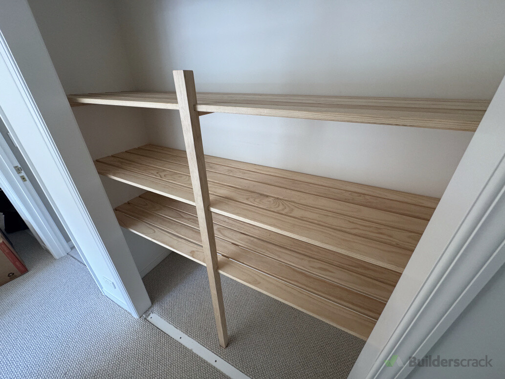 Laundry cupboard slatted shelving
