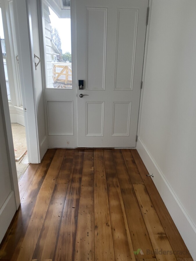 Installed a new front door and sidelight joinery unit as part of a colonial home renovation. Laid recycled native timber floorboards to achieve the client’s desired rustic finish while preserving the home’s character.