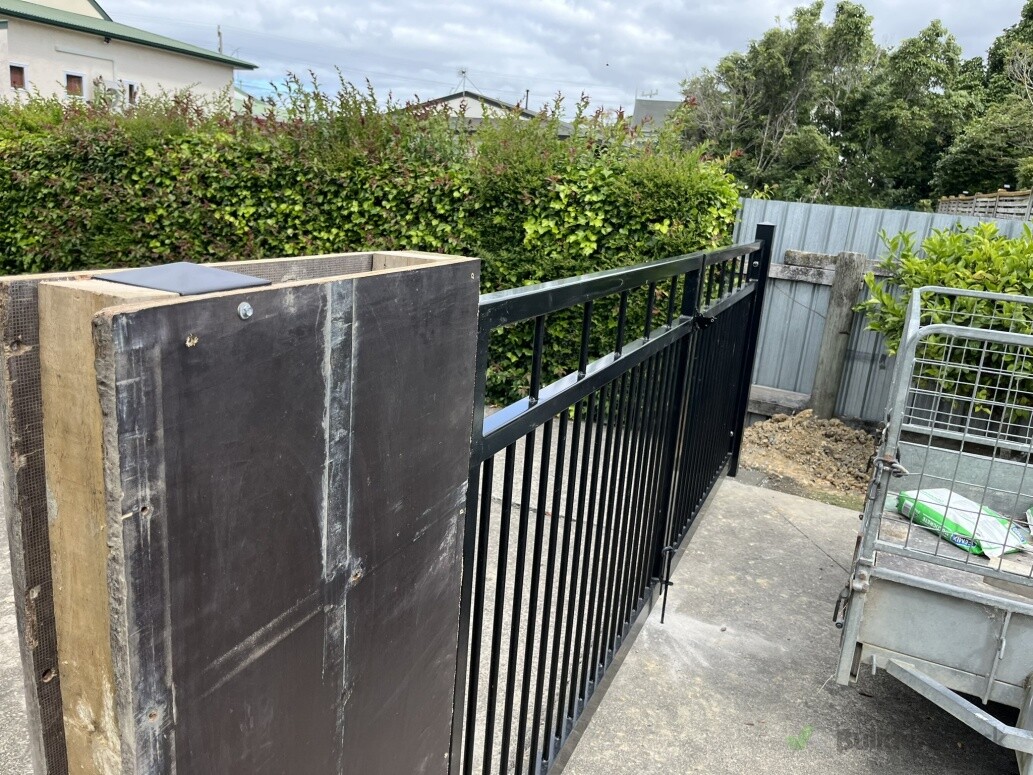 Temporary wooden frame installed while waiting for the new fencing materials to arrive.