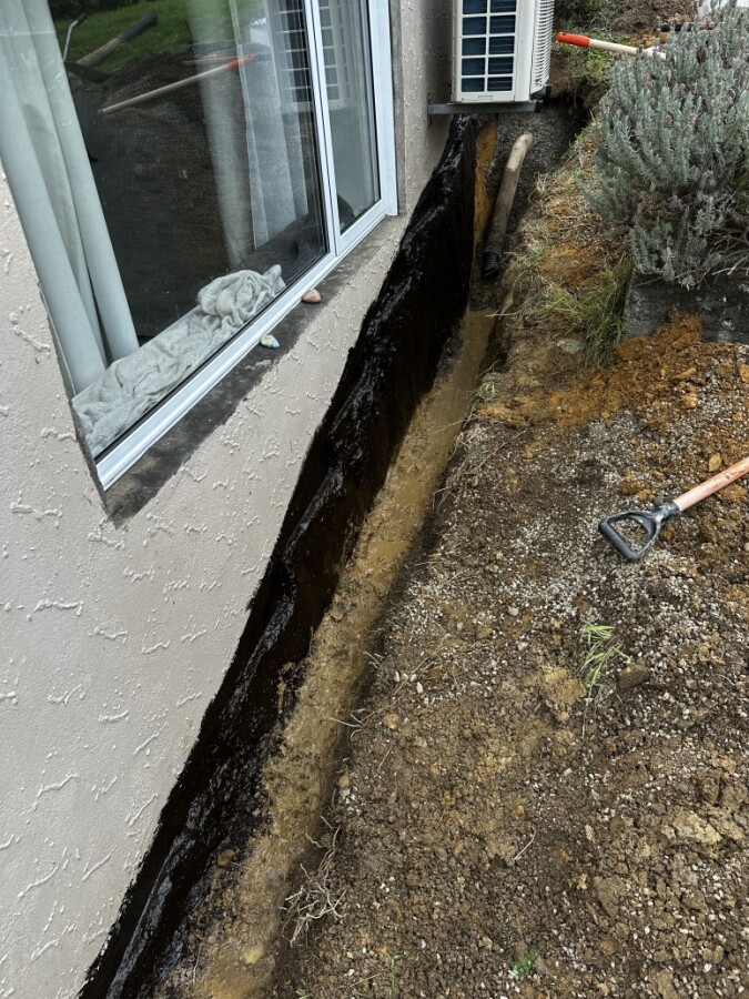 tar seal and new drainage because the house was having a water leak issue