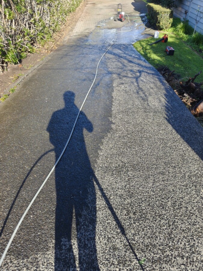Waterblasting driveway after moss treatment