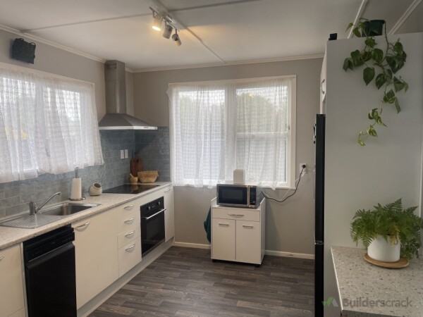 Installed mobile microwave cabinet to optimise space, new paint to walls and new vinyl