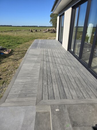 Deck finished flush with existing outdoor living area.