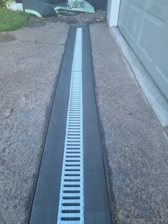 Finished product, concrete edges cleaned up, tape removed and a brush finish applied.