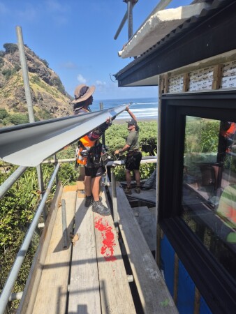 Installing new quarter round gutter on piha beach
