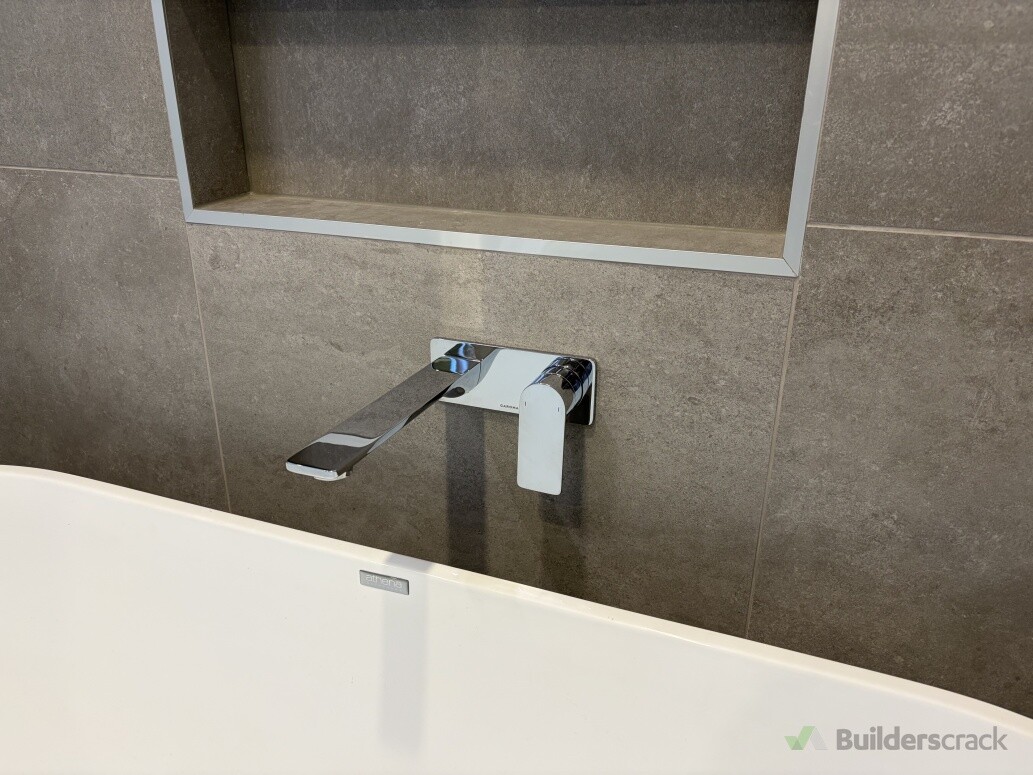 Tile reinstated and new mixer/spout installed