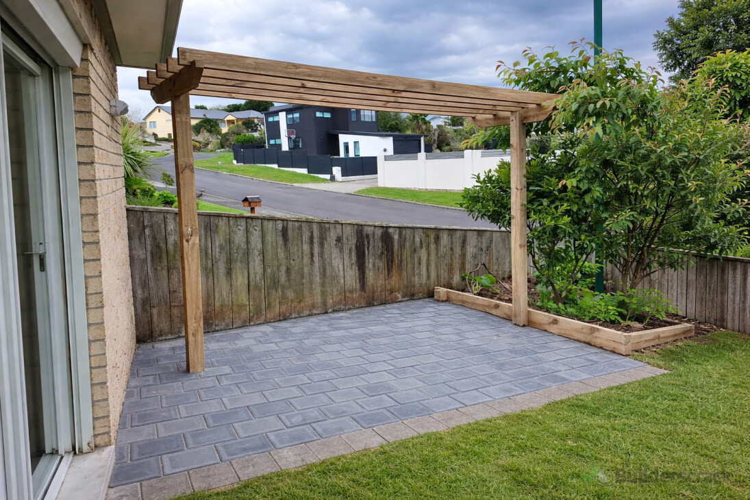 Pergola & paving installation in Hamilton & Waikato, custom timber pergola with paved outdoor area, creating a practical and inviting space for outdoor living.