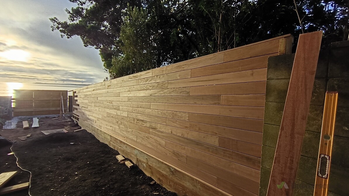 A client had seen a local fence with horizontal pine palings and  wanted something similar. We came up with using vitex decking instead of pine and retained the soil on the other side with treated pine.