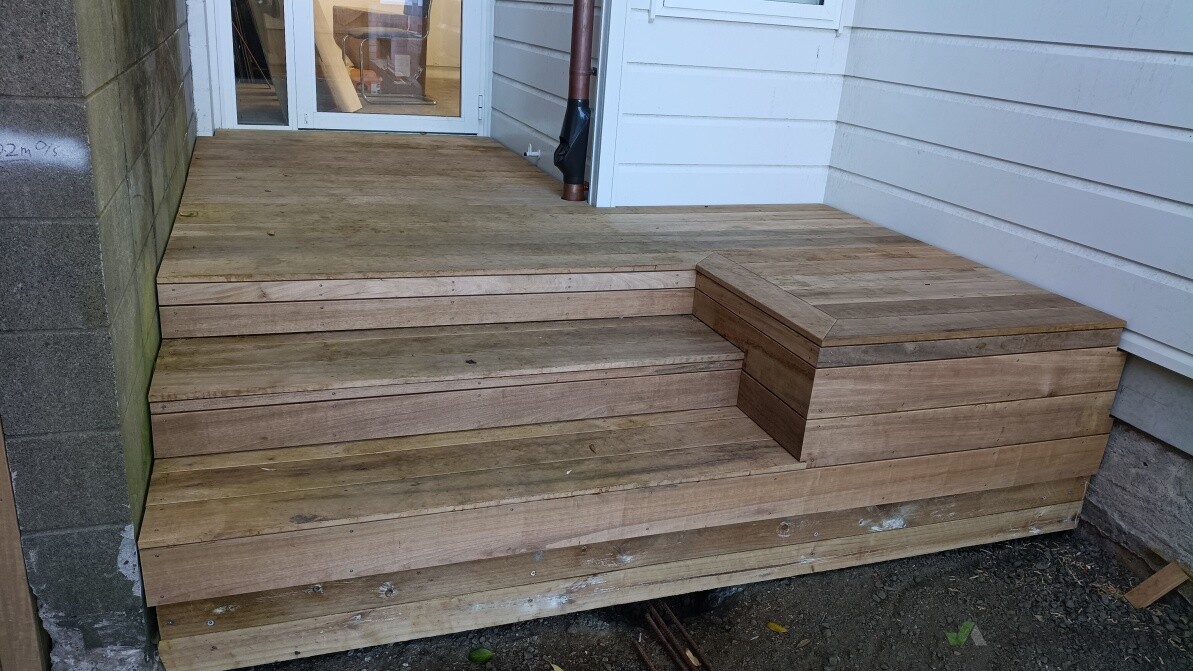 Vitex decking leading to the back door. An exposed aggregate concrete ramp was later poured to the bottom of the lower decking board.