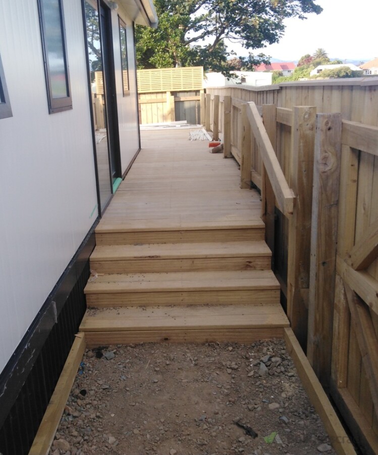 Rear stairs and wrap around deck for usable entertaining space