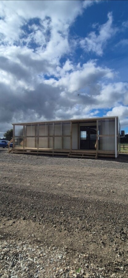 Enclosed deck for transportable office block