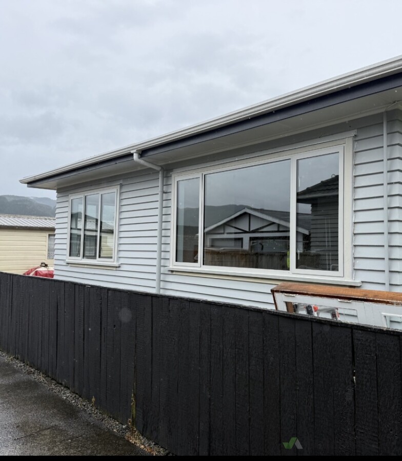 New double glazed aluminium windows with timber facings to match existing windows of the house.