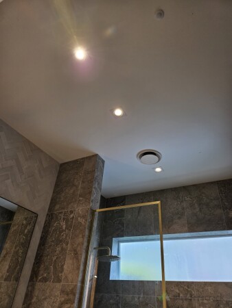 Installed modern LED downlights and a new extract fan to improve lighting, ventilation and comfort.