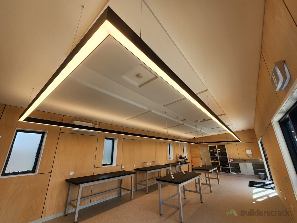 Suspended LED track lighting in workshop