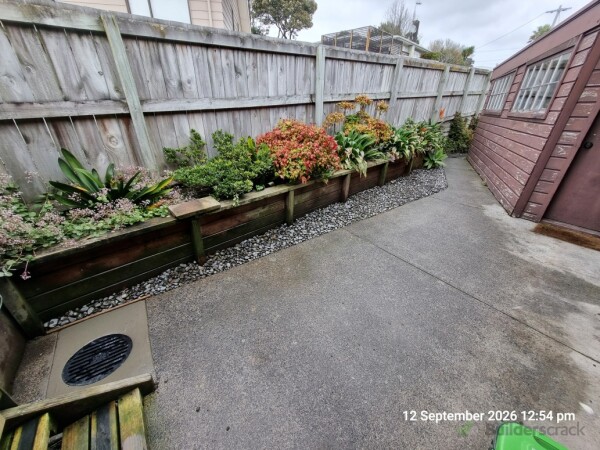 Finished product, river stones to make a decorative finish and concrete re-instated around the cesspit.