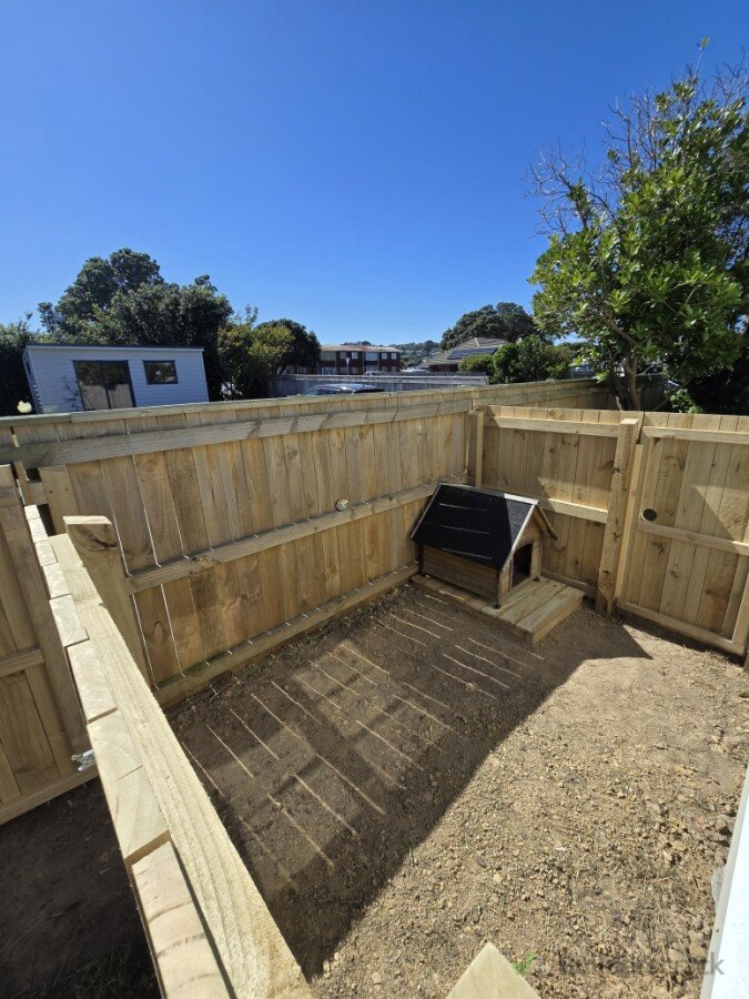Dog run with walk through gates retaining full access to property