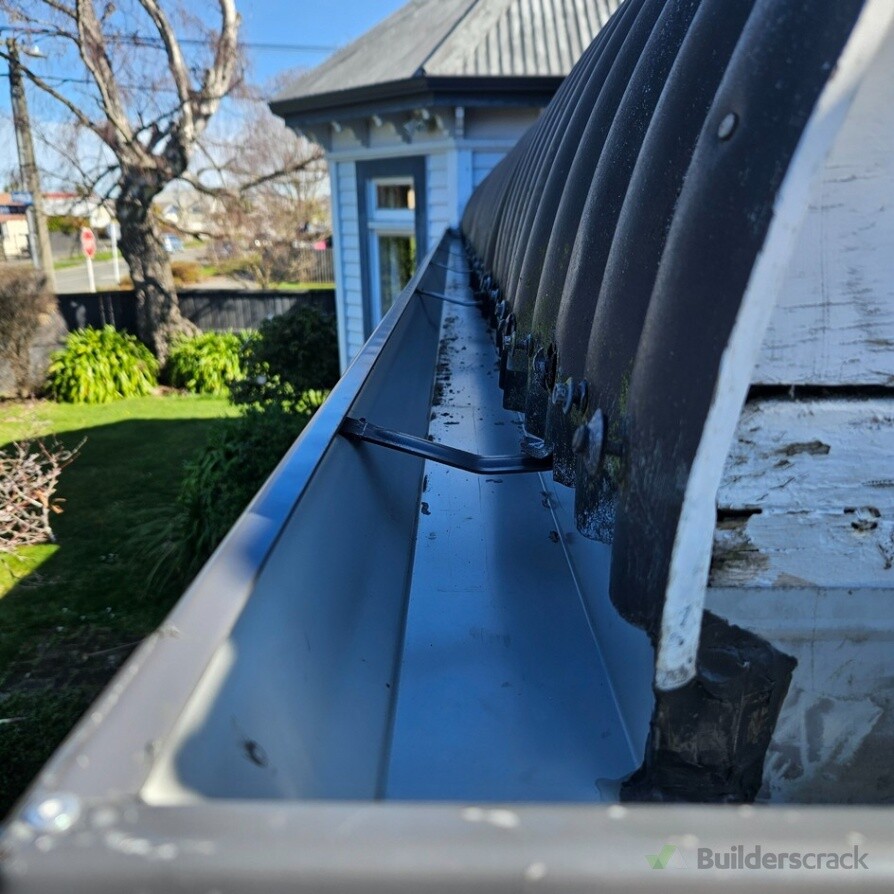 Rust treatment on bullnose roof sheeting and new spouting installed.