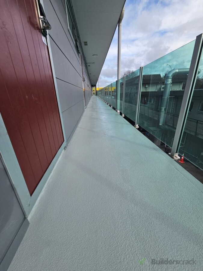 Completed waterproofed epoxy walkway with slip-resistant grit finish – Zetas Motel, Hamilton.